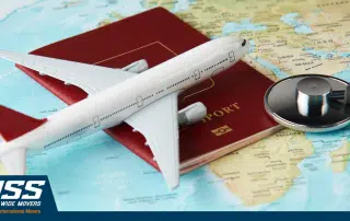 World map, passport, stethoscope and toy plane